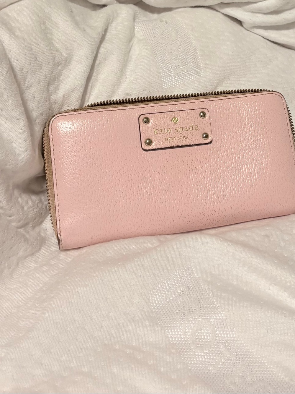 kate spade blush pink zip-around leather wallet with gold plaque